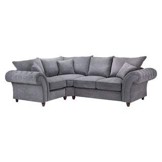 The Beehive Furniture Windsor Fullback Grey Corner Sofa features a left hand facing design, button-tufted arms, plush cushions, short wooden legs, and an elegant upholstered finish for comfort.