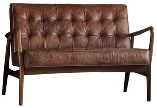 The Humber Vintage Brown Leather 2 Seater Sofa by Gallery Direct features a mid-century modern design with a wooden frame, armrests, and tufted seat and backrest—combining stylish comfort with durable construction.
