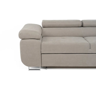 A close-up of the PF Sofas SOFAINSTORE Ferrano Beige Fabric Corner Sofa Bed, an L-shaped design with plush cushions, metal legs, fold-out sleeper, and hidden storage, shown against a plain white background.