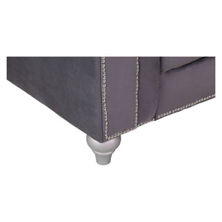 Close-up of the Jubilee Grey Velvet 2 Seater Sofa by Beehive Furniture, featuring elegant button-tufted details, silver nailhead trim, and a white turned wooden leg—ideal for a modern living room.