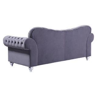The Beehive Furniture Jubilee Grey Velvet 3 Seater Sofa features a modern, button-tufted design with rolled arms and light wood legs—an elegant addition to any living room.