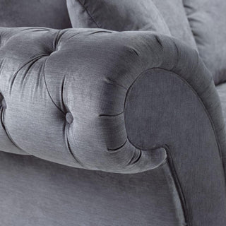 Close-up of a tufted armrest on the Beehive Furniture Windsor Fullback Grey Corner Sofa (Right Hand Facing), showcasing detailed stitching and button accents—an elegant design feature for any modern living space.