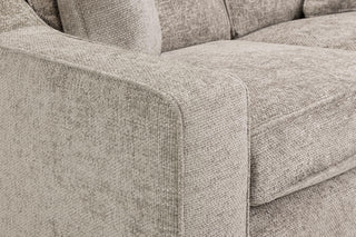 Close-up of the Beehive Furniture Nebraska Beige Fabric 3+2 Seater Sofa, showing the armrest, seat cushion, backrest, and matching throw pillow. The elegant comfort and detailed fabric weave of this luxurious design stand out.