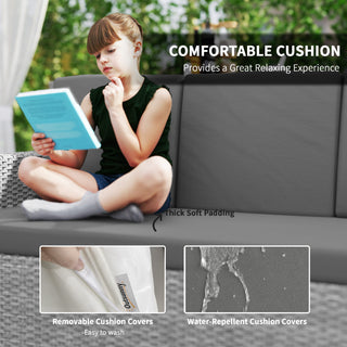 A young girl relaxes on the Outsunny Seven-Piece Rattan Garden Sofa Set in Light Grey, enjoying its thick soft padding, comfy cushions, removable easy-to-wash covers, and water-repellent cushion covers.