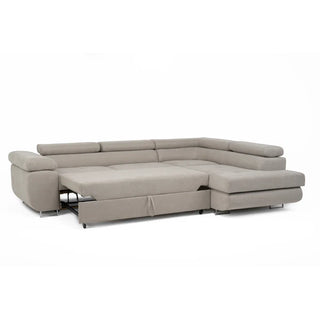 The PF Sofas SOFAINSTORE Ferrano Beige Fabric Corner Sofa Bed is an L-shaped sofa with a fold-out sleeper and hidden storage, offering comfort and versatility against a white background.