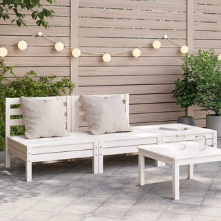 A modern outdoor patio showcases the vidaXL Garden Sofa 3-Seater White Solid Wood Pine (838034) with beige cushions, complemented by a small white table, two glasses, string lights on a wooden fence, and green plants in the background.