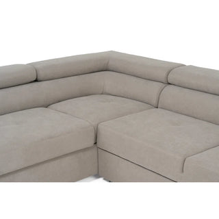 A close-up of the PF Sofas SOFAINSTORE Ferrano Beige Fabric Corner Sofa Bed, L-shaped with padded cushions, fold-out sleeper, and hidden storage.