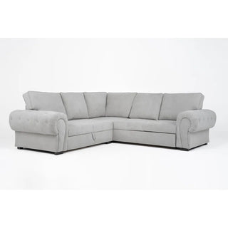 The PF Sofas SOFAINSTORE Light Grey Fabric Corner Sofa Bed features deep seats, rolled arms, cushioned backrests, and hidden underseat storage, shown here in an L-shape against a plain white background.