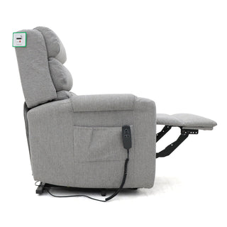 The RS Furniture SOFAINSTORE Bramley Grey Electric Rise & Recline Armchair is shown side-on with its footrest extended. This dual motor chair has a remote in the side pocket and a USB port by the backrest for added comfort and convenience.