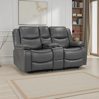 A modern living room with the Beehive Furniture SOFAINSTORE Harald Grey Leather Electric Recliner Sofa – 2 Seater, featuring dual power, contrast stitching, and a cupholder console on a light rug, with shelves, books, decor, large window & floral art.
