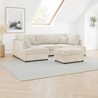 A bright living room showcases the Beehive Furniture SOFAINSTORE Beige Bouclé Fabric U-Shape Corner Sofa with Ottoman, set on a light gray rug. Light wood floors, an abstract artwork, pampas grass, a small plant, and a skylight complete the contemporary space.
