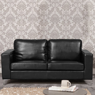 The KH Sofas Woodleigh Leather 3 Seater Sofa in black, featuring two comfortable foam seat and back cushions, sits against gray and white floral wallpaper—a stylish modern living room centerpiece.