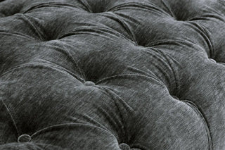 Close-up of Beehive Furnitures Jubilee Charcoal Grey Velvet Sofa, a 3-seater with button-tufted design and plush texture—ideal for elegant living rooms.