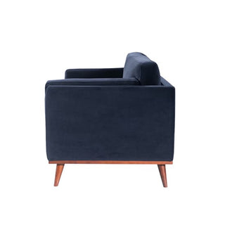 Side view of the Maili Velvet Fabric 2 Seater Sofa by Twenty Ten Designs in midnight blue, featuring cushioned comfort and wooden legs—ideal for any modern living space.