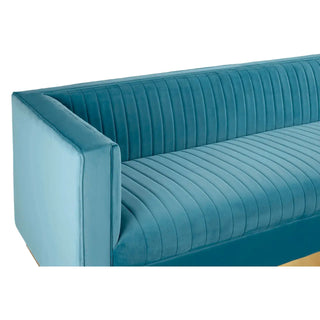 The Premier Sofas Contemporary Light Blue Velvet 3 Seater Sofa showcases vertical tufted detailing, clean lines, boxy armrests, and an elegant gold base for a modern look.