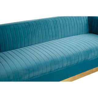 A close-up of the Premier Sofas Contemporary Light Blue Velvet 3 Seater Sofa, featuring a tufted design and elegant gold base.