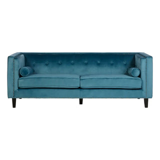 The Felisen Upholstered Velvet 3 Seater Sofa by Premier Sofas features a blue velvet finish, square arms, button tufting, nailhead trim, two bolster pillows, and two seat cushions on four black legs for sturdy elegance.