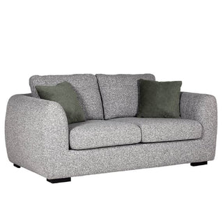 The Vida Living Santiago Fabric 2 Seater Sofa features grey upholstery, black legs, wide rounded arms, two seat and back cushions, and two dark green accent pillows—an ideal modern living room furniture piece.