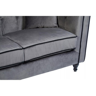 Close-up of the Hannah Upholstered Velvet 3 Seater Sofa by Premier Sofas in Grey Elegance, featuring chic black piping, two seat cushions, and black turned legs—a stylish choice for luxury sofas in the UK.