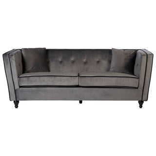 The Hannah Upholstered Velvet 3 Seater Sofa by Premier Sofas features chic grey elegance with tufted backrest, straight arms, short dark wooden legs, and two matching cushions—ideal for luxury UK-style living.