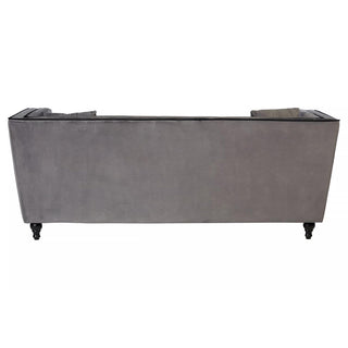 A back view of the Hannah Upholstered Velvet 3 Seater Sofa by Premier Sofas, featuring modern grey elegance, straight lines, black piping detail, and four short black legs—a chic luxury UK-style sofa.