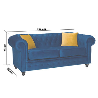 The PF Sofas SOFAINSTORE Florencia Navy Blue Fabric Chesterfield 2 Seater features scroll arms, button tufting, luxe velvet upholstery, dark wooden legs, and measures 194cm wide, 74cm high, and 90cm deep. Includes two yellow cushions.