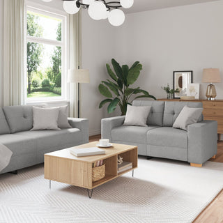 A bright, modern living room featuring the vidaXL 3-Piece Sofa Set with Cushions in Cloud Grey Fabric, paired with a wooden coffee table, white rug, leafy plant, floor lamp, large window, framed art, and decor in neutral tones.