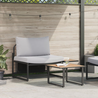 Create a modern patio space with the vidaXL SOFAINSTORE 2 Piece Garden Armchair Set, featuring light grey cushions, black frame, and paired with a square wooden coffee table, potted plants, string lights, and a wooden fence backdrop.