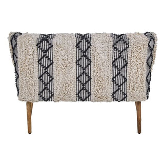 The Nestium FURCO Boho-Inspired 2 Seater Sofa features black velvet upholstery with sturdy mango wood legs, combining boho charm and contemporary style.