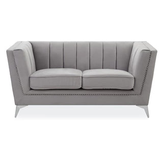 The Premier Sofas Hefei Velvet 2 Seater Sofa in grey fabric features vertical tufting, chrome metal legs, two seat cushions, and angled armrests—ideal for modern living rooms.
