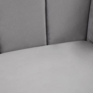 Close-up view of the Premier Sofas Hefei Velvet 2 Seater Sofa in grey fabric with chrome metal legs, showcasing its smooth upholstery, subtle seams, and padded seat and backrest—an elegant modern living room addition.