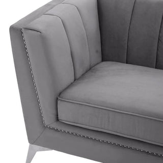 Close-up of the Premier Sofas Hefei 3 Seater Sofa in grey velvet, featuring chrome metal legs and chic design—an elegant piece to elevate any modern living space.