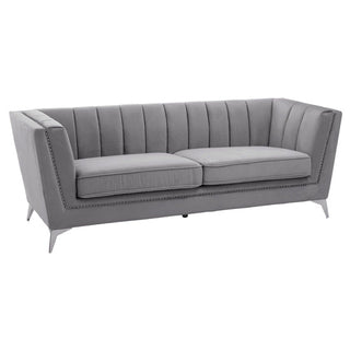 The Hefei 3 Seater Sofa by Premier Sofas features grey velvet upholstery, chrome metal legs, and a chic high-back design—an elegant addition to any modern living room.