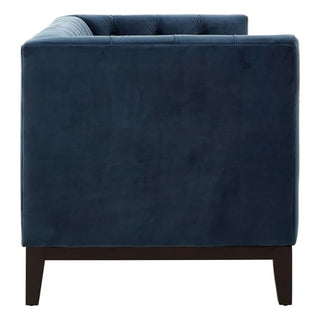 Side view of the Premier Sofas Okab Velvet 2 Seater Sofa in Midnight Blue Elegance, featuring a tufted backrest, black wooden legs, and a stylish modern design with plush upholstery.
