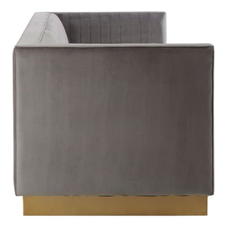Side view of the Premier Sofas Grey Velvet 3 Seater Sofa featuring vertical channel tufting and a sleek gold base, set against a white background.