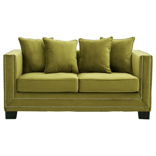 The Pipirima 2 Seater Sofa by Premier Sofas features moss green velvet upholstery, square arms, silver nailhead trim, two seat cushions, four throw pillows, and dark wooden legs—ideal for modern living rooms.