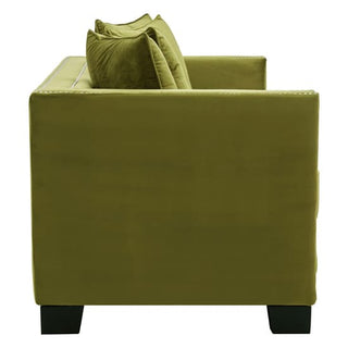 Side view of the Pipirima 2 Seater Sofa by Premier Sofas, upholstered in moss green velvet with two matching cushions, straight armrests, and black square legs—an elegant choice for modern living rooms.