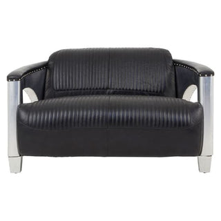 The Premier Sofas Contemporary Black Leather 2 Seater Sofa features channel tufting, aluminium arms, and sleek silver legs, shown front-facing on a white background.