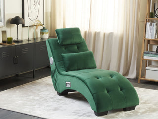 The Beliani SOFAINSTORE Maestro Green Velvet Chaise Lounge features tufted cushions, built-in Bluetooth speakers, and a USB port, adding modern tech to your living room alongside neutral curtains, a black sideboard, and stylish wall art.