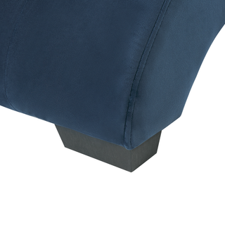Close-up of a dark wooden leg supporting the Beliani SOFAINSTORE Blue Velvet Fabric Chaise Lounge, featuring tufted upholstery, a cushioned headrest, inbuilt Bluetooth speakers, and USB charging port against a white background.