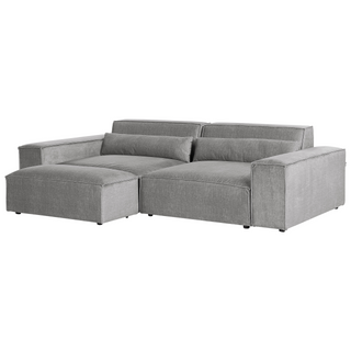 The Beliani SOFAINSTORE Grey Fabric 4 Seater Sofa features an oversized modern design with deep cushions, wide armrests, and a chaise lounge on the left—perfect for stylish comfort in any living room.