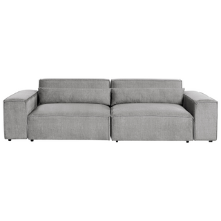 The Beliani SOFAINSTORE Grey Fabric 4 Seater Sofa features an oversized modern design with deep cushions and wide armrests for lounge comfort, shown from the front against a white background.