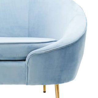 The Premier Sofas Aqua Blue Velvet 3 Seater Sofa features gold metal legs, a curved backrest, and plush seat cushions, combining modern style and comfort for any space.