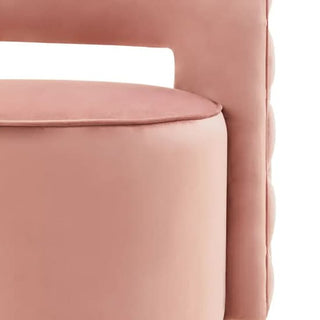 Close-up of Premier Sofas’ Pink Velvet Swivel Chair for Bedroom—modern design with plush cushioning, curved backrest, and round seat for a soft, stylish accent.