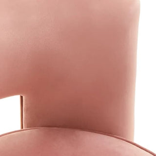 Close-up of the Premier Sofas Pink Velvet Swivel Chair for Bedroom, showcasing its plush cushioning, modern design, and a subtle cutout detail on the lower backrest.